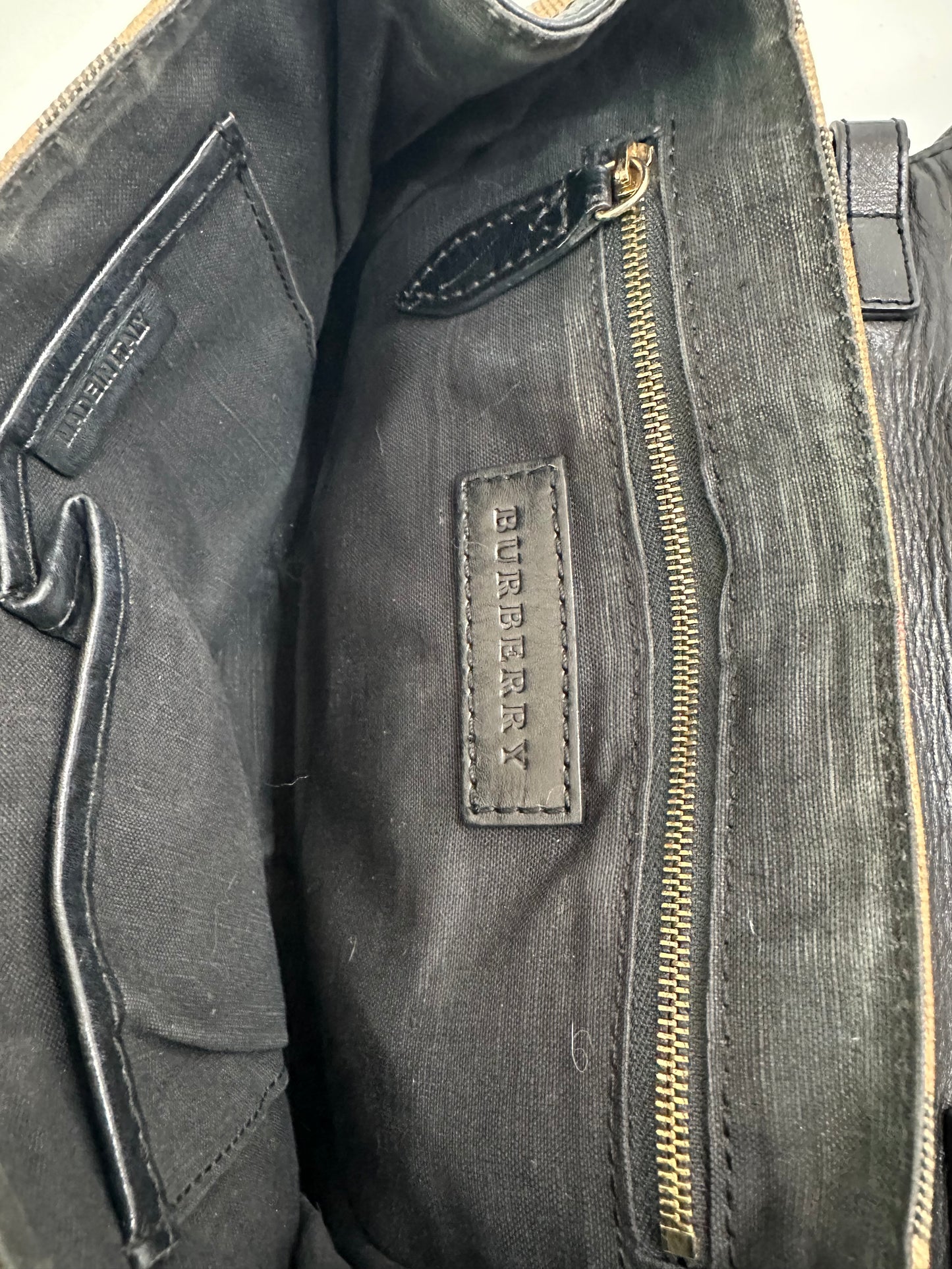 BURBERRY
Black Leather And House Check Canvas Abbott Crossbody