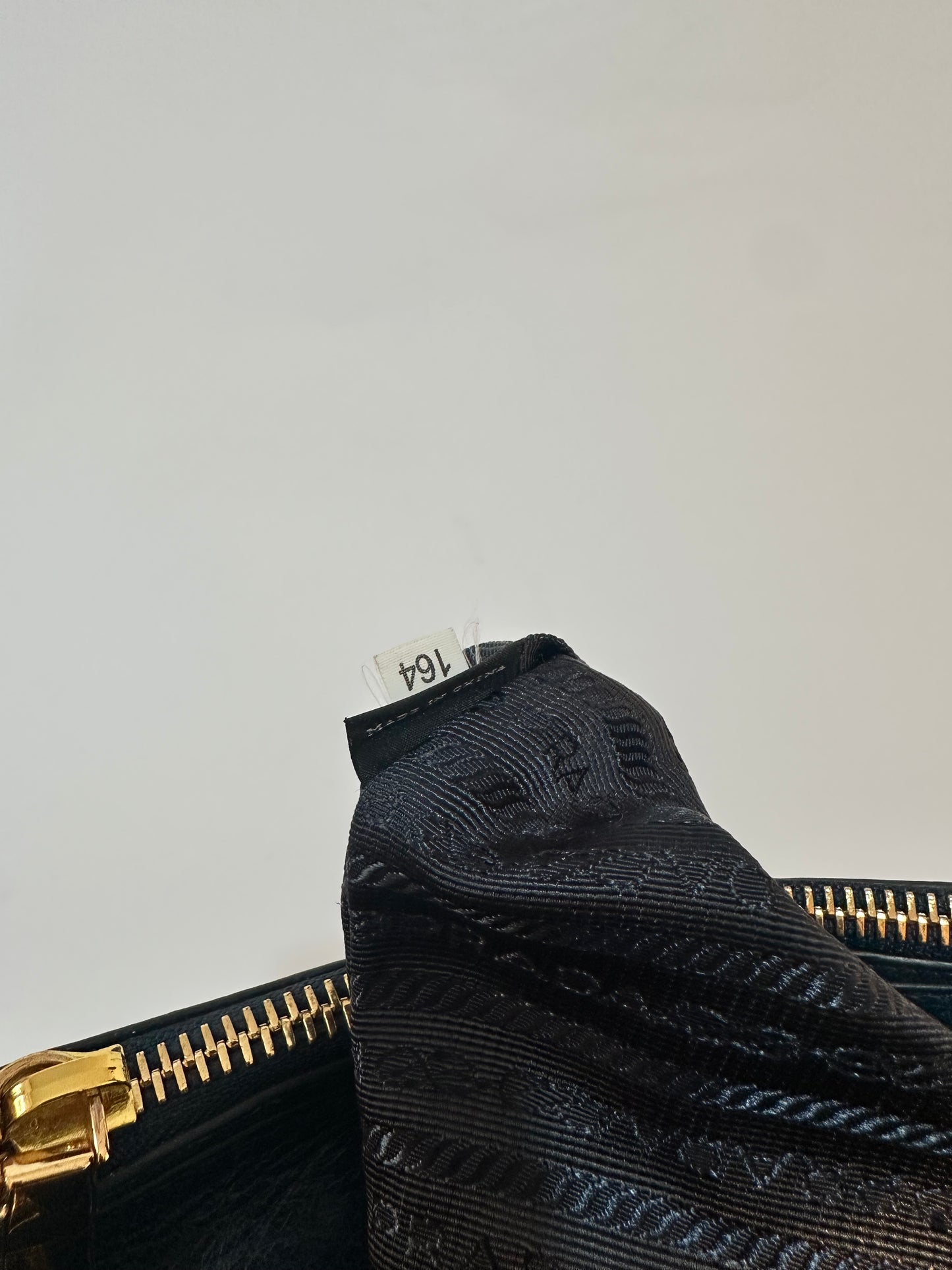 PRADA
Denim Blue Vitello Shine Leather Bauletto Bag