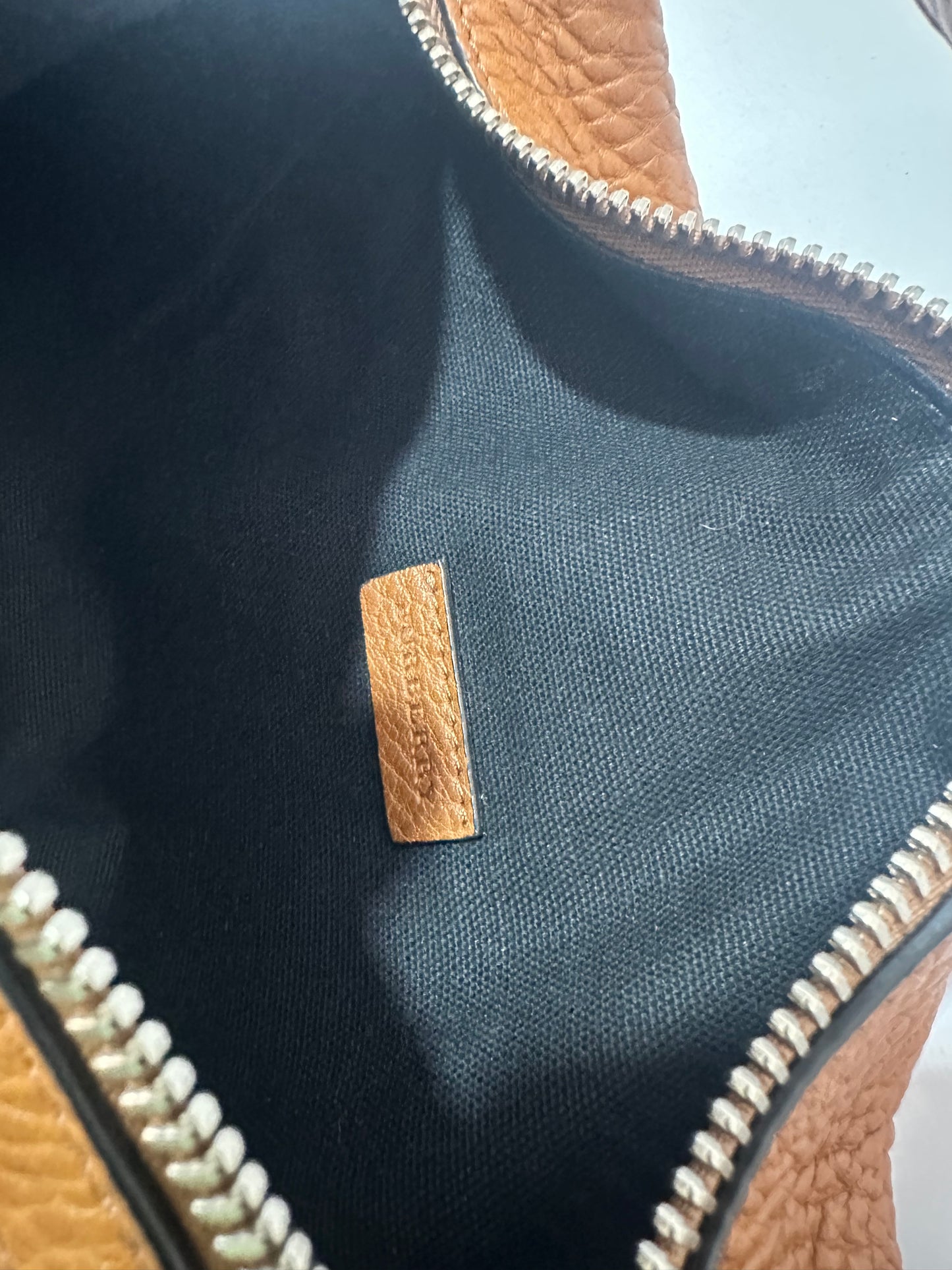 BURBERRY
Mega Check Small Farley Crossbody Clutch Bag Saddle Brown