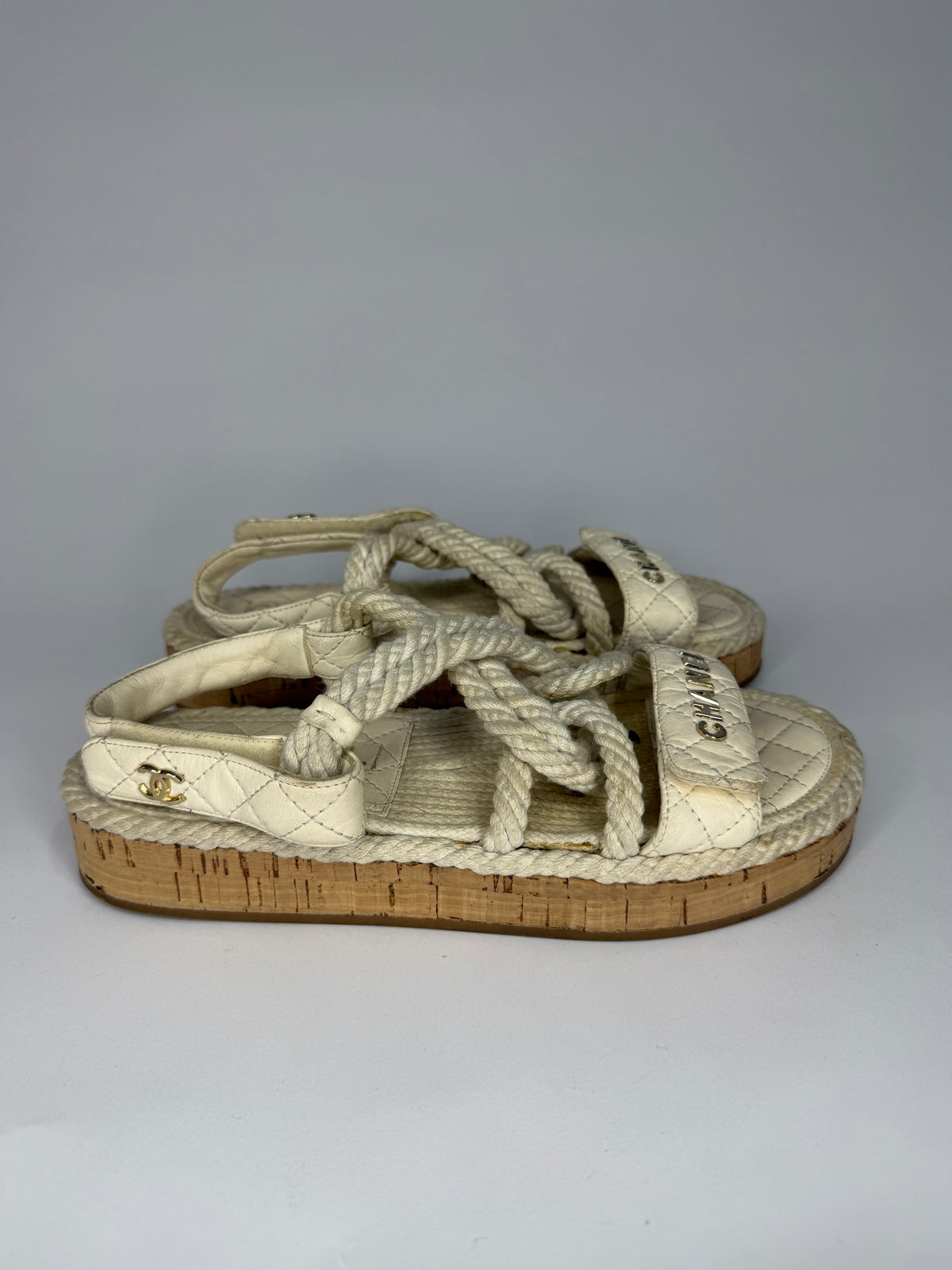 CHANEL
Cord Lambskin Quilted Logo Sandals White Size 37 EU/ 4 UK/ 7 US