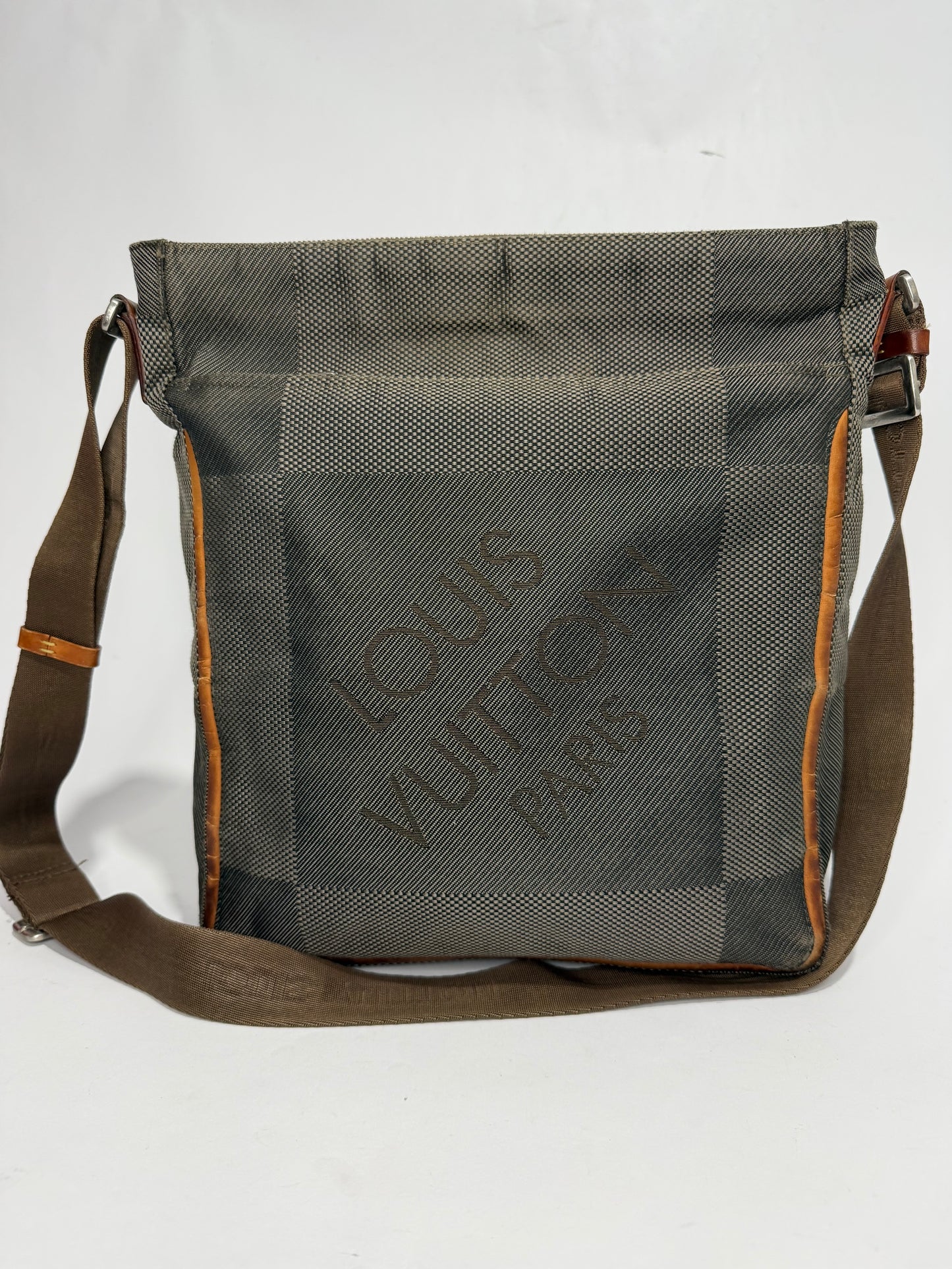 LOUIS VUITTON
Terre Damier Geant Vertical Messenger Bag