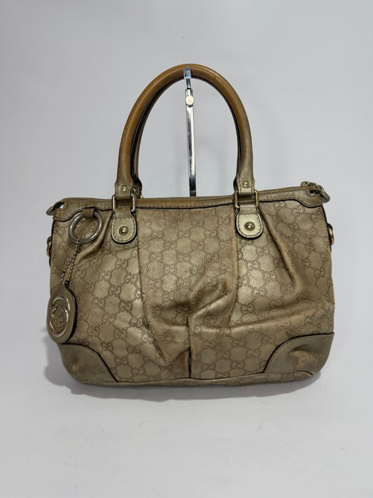 GUCCI
Metallic Soft Guccissima Medium Sukey Top Handle Bag Champagne