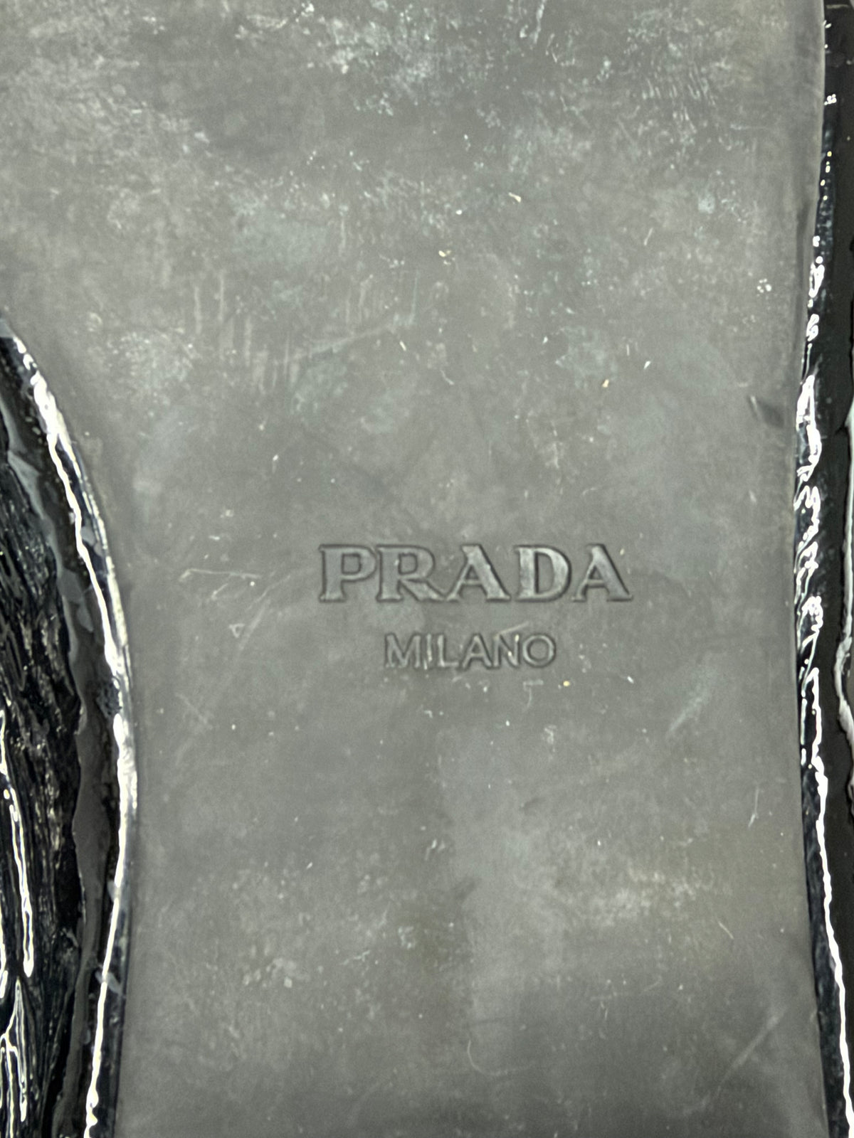 Prada
Enameled Metal Triangle Leather Loafers
Women's Size 37.5 EU/ 7.5 US/ 4.5 UK