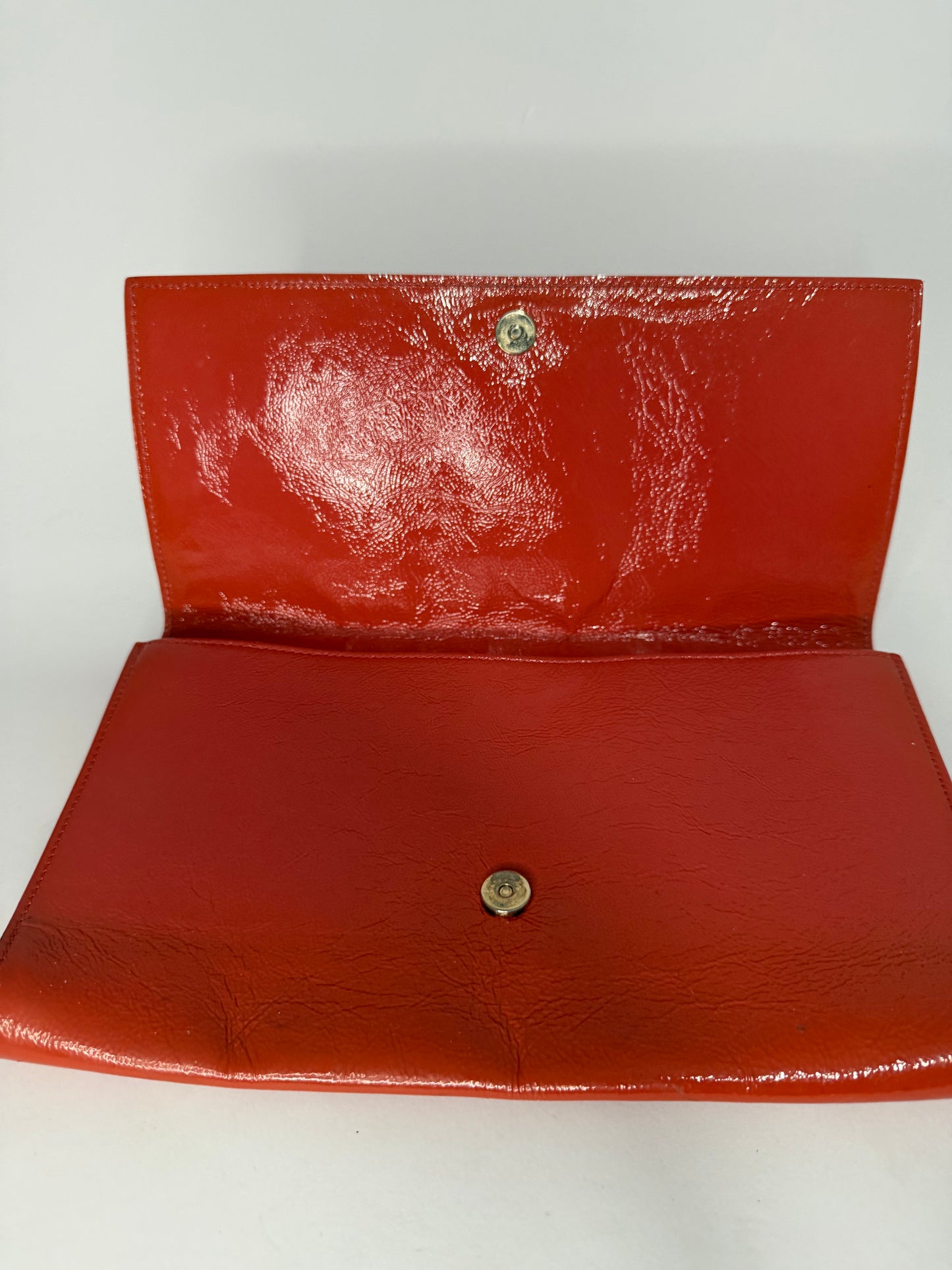 YVES SAINT LAURENT
Dark Orange Patent Leather Belle De Jour Large Clutch Bag