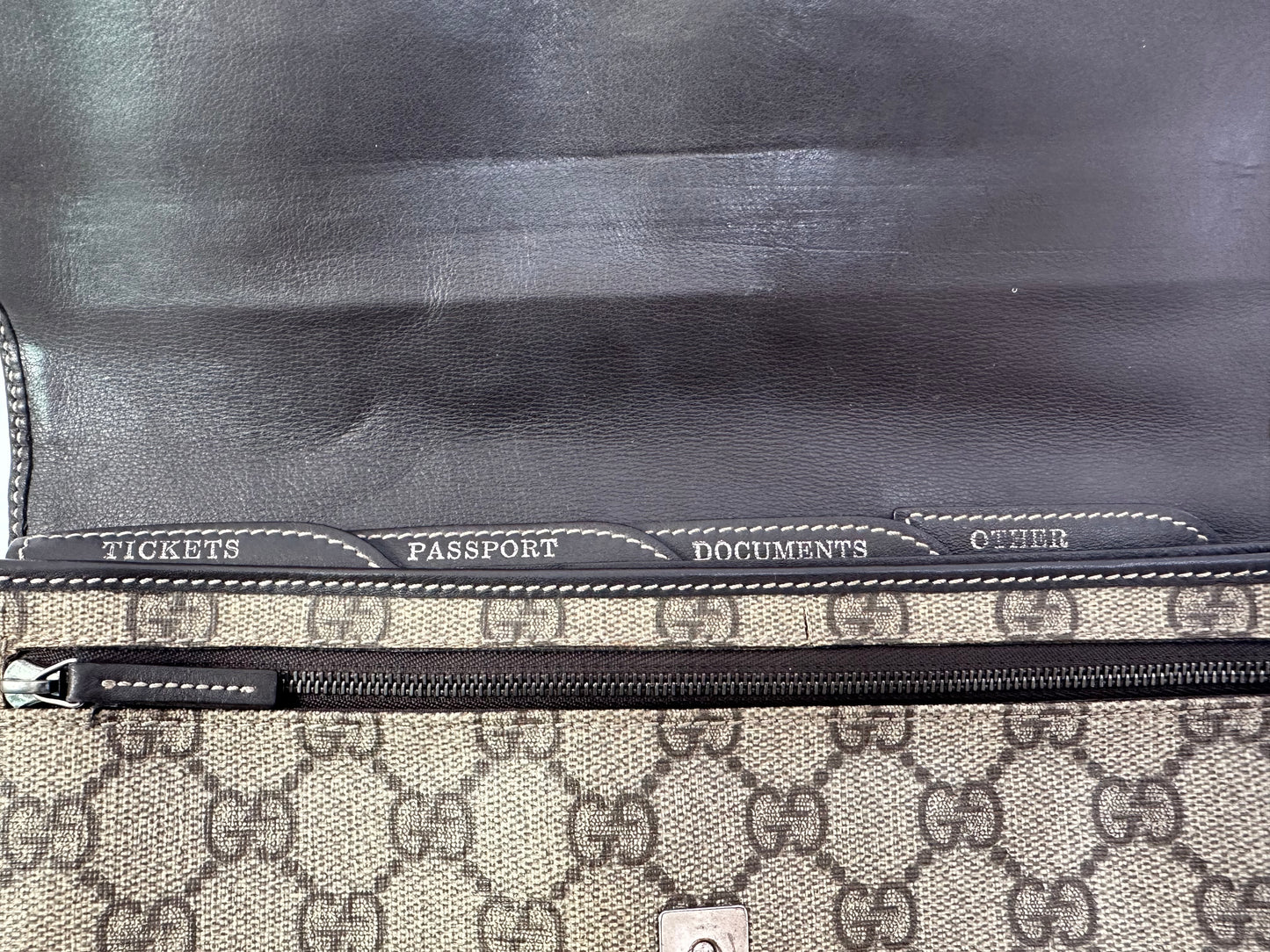 GUCCI 
GG Supreme Monogram Clutch Document Holder Brown