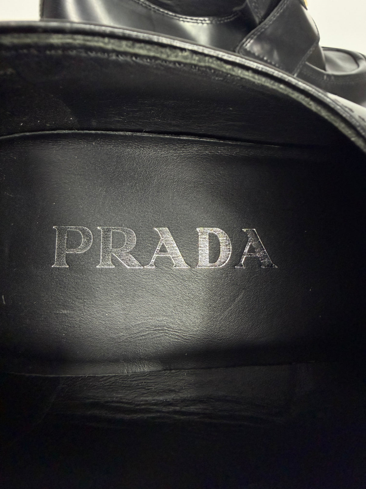 Prada
Enameled Metal Triangle Leather Loafers
Women's Size 38 EU/ 8 US