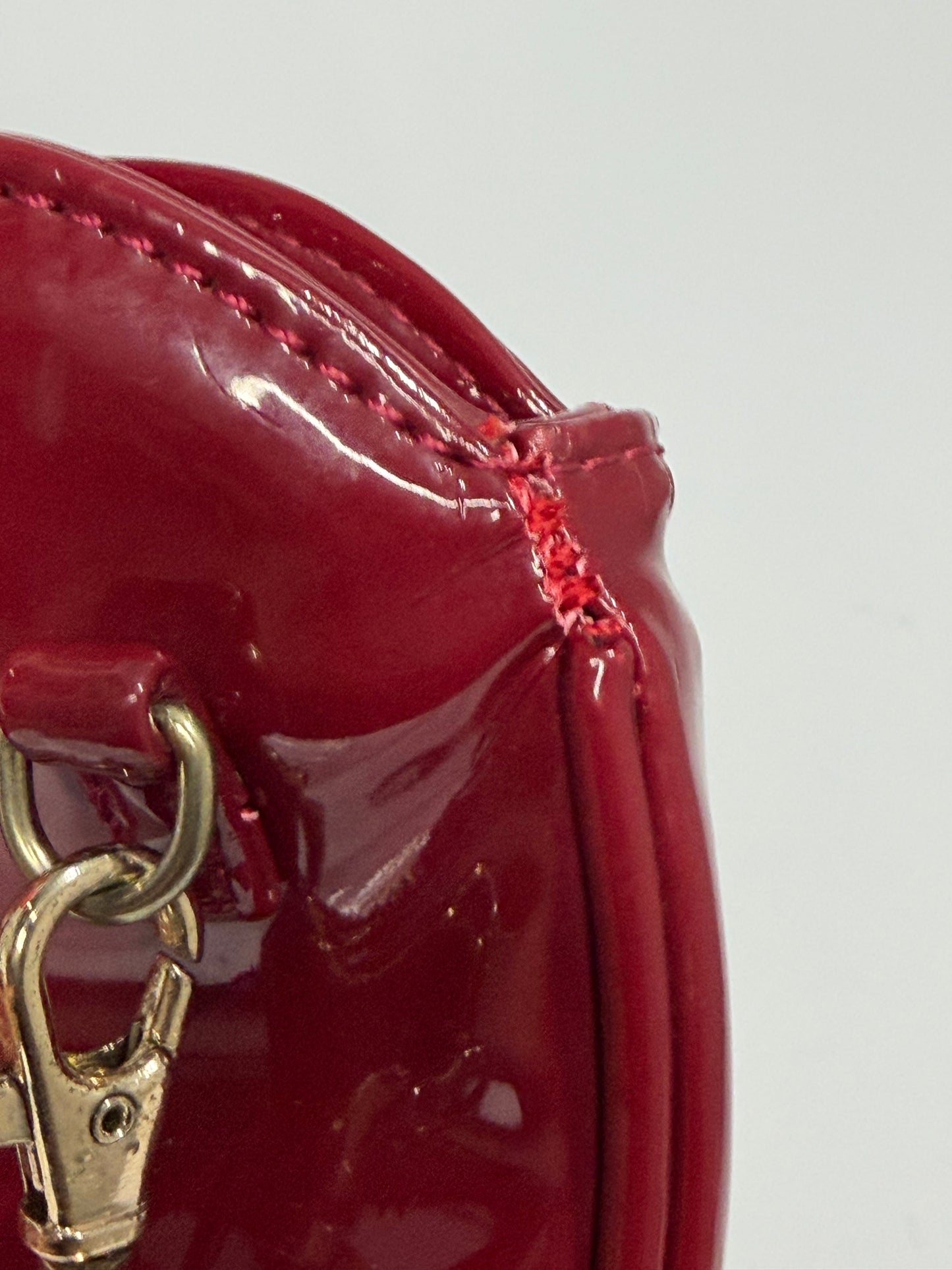 Vivienne Westwood
Patent Leather Heart Crossbody Bag