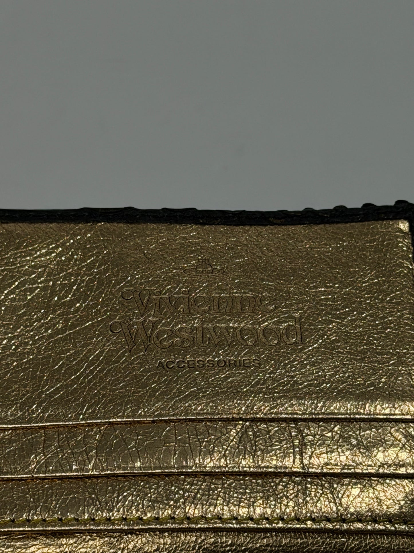 VIVIENNE WESTWOOD
Frilly Snake Patent Wallet In Black