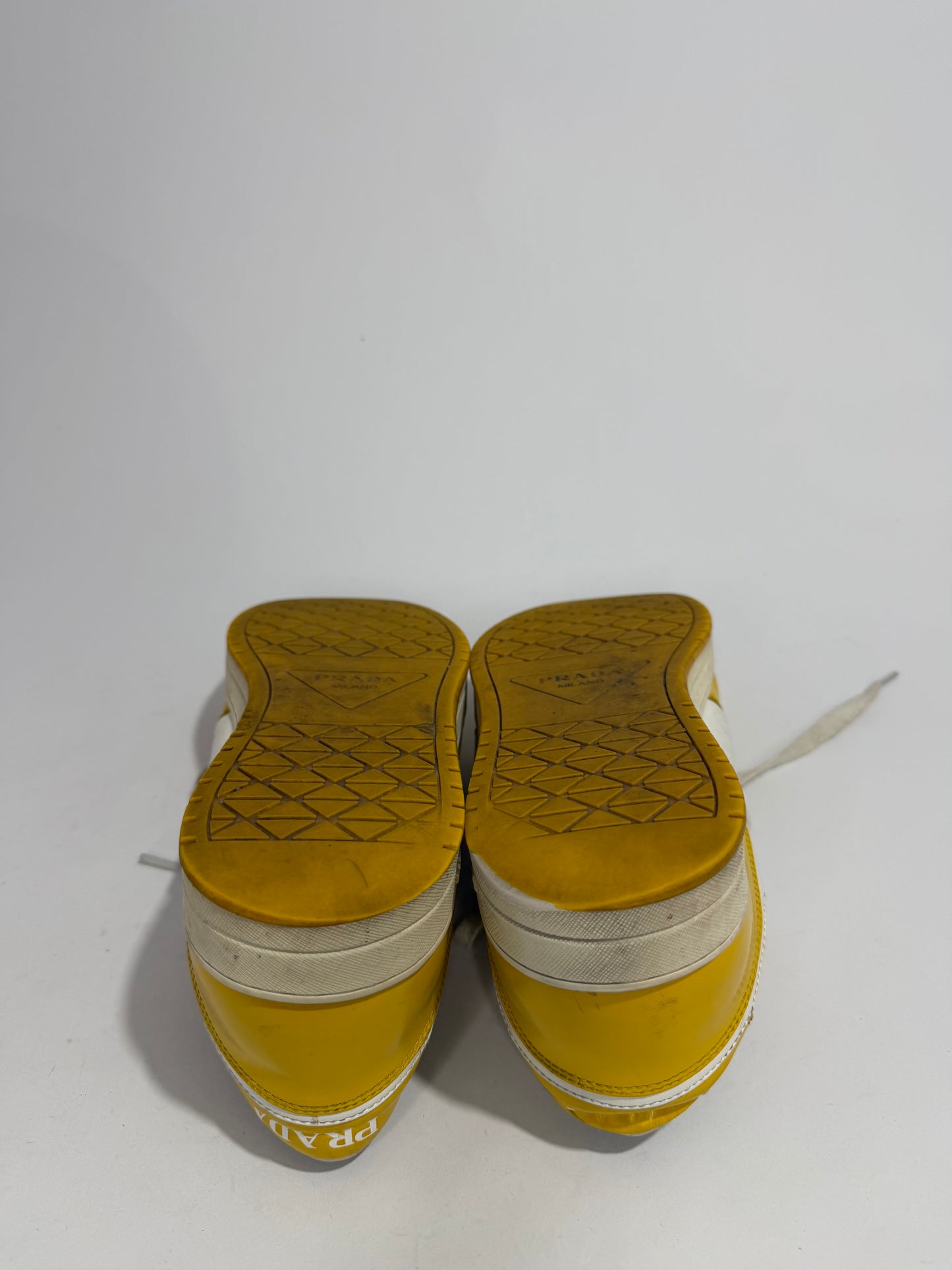 Prada
Enameled Metal Triangle Leather Sneakers