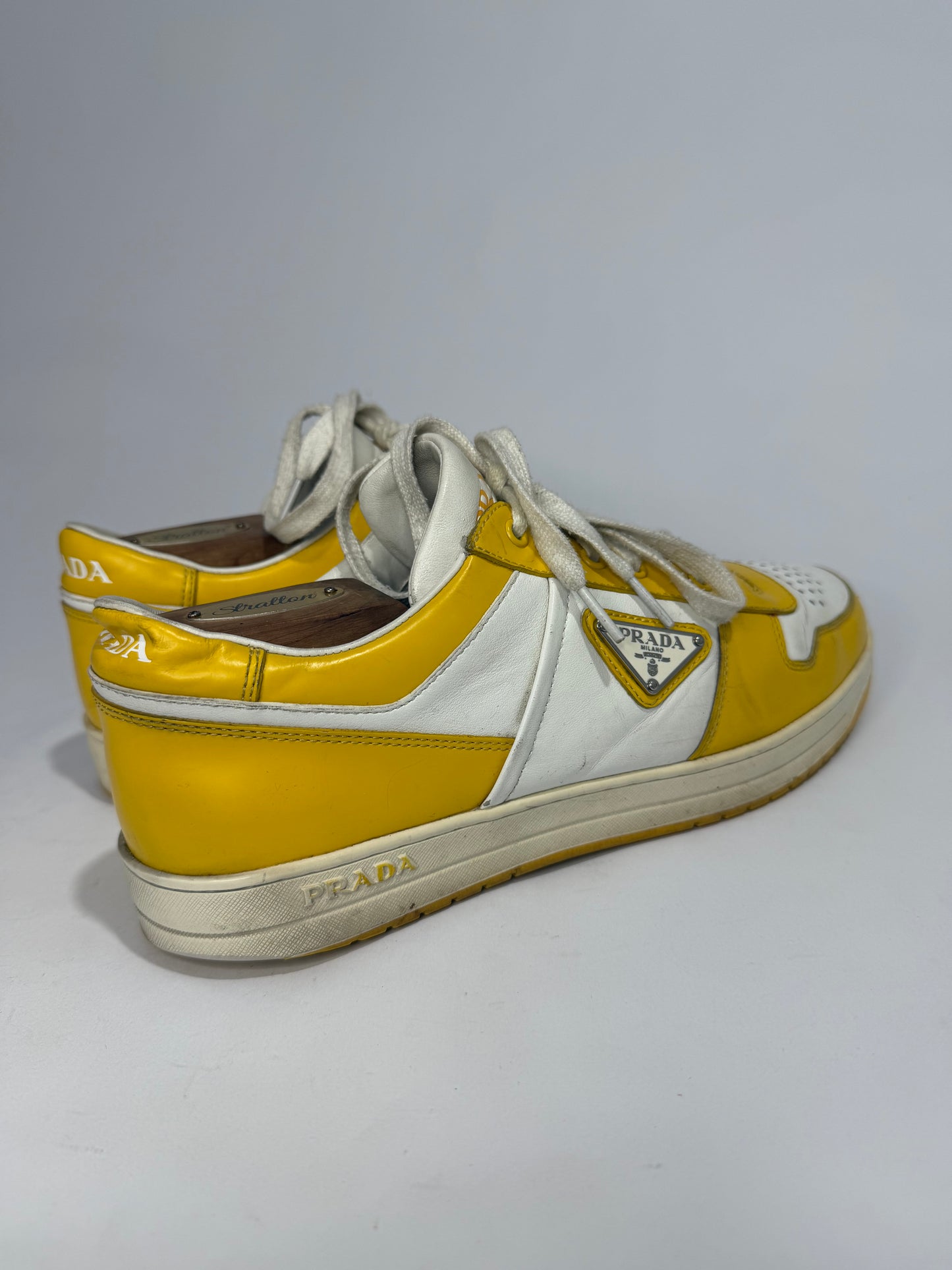 Prada
Enameled Metal Triangle Leather Sneakers
