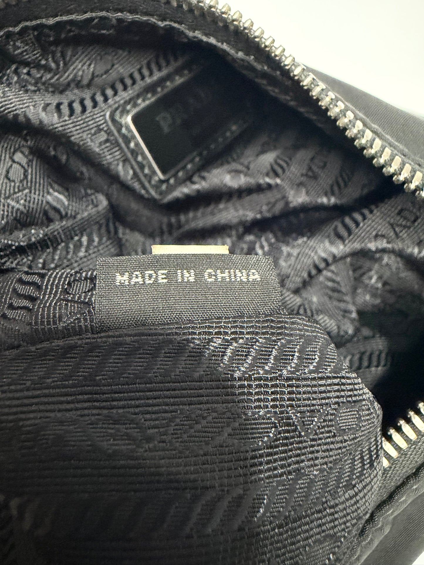 Certified Authentic
PRADA
Re-Nylon Saffiano Re-Edition 2000 Double Zip Crossbody Bag Black