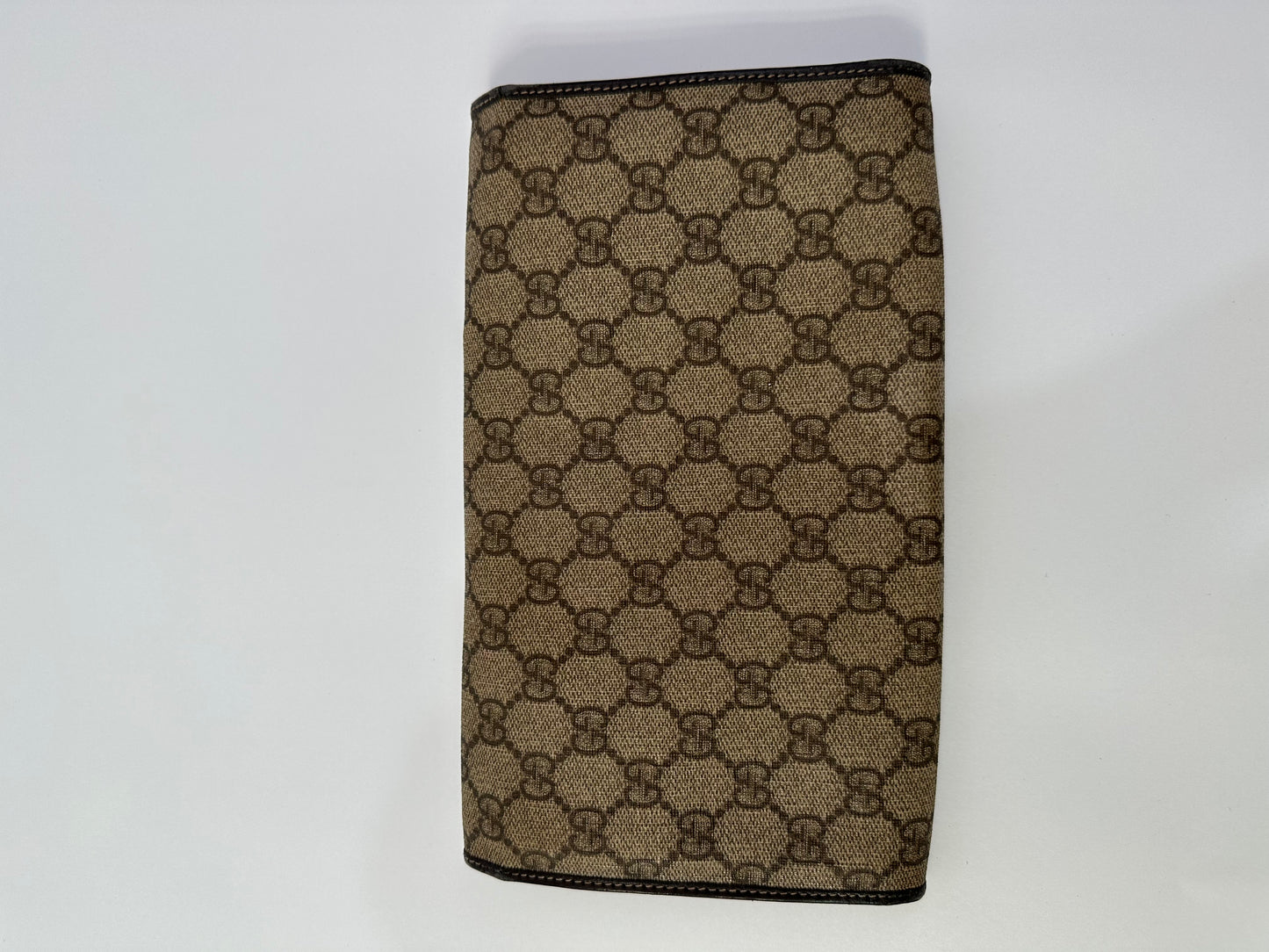 GUCCI 
GG Supreme Monogram Clutch Document Holder Brown