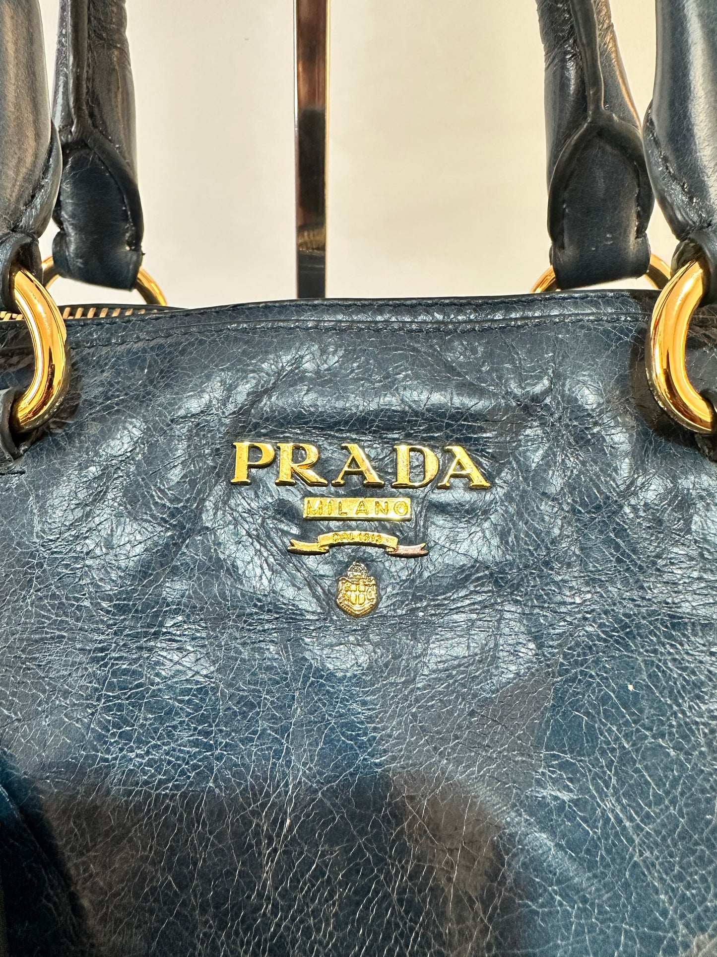 PRADA
Denim Blue Vitello Shine Leather Bauletto Bag