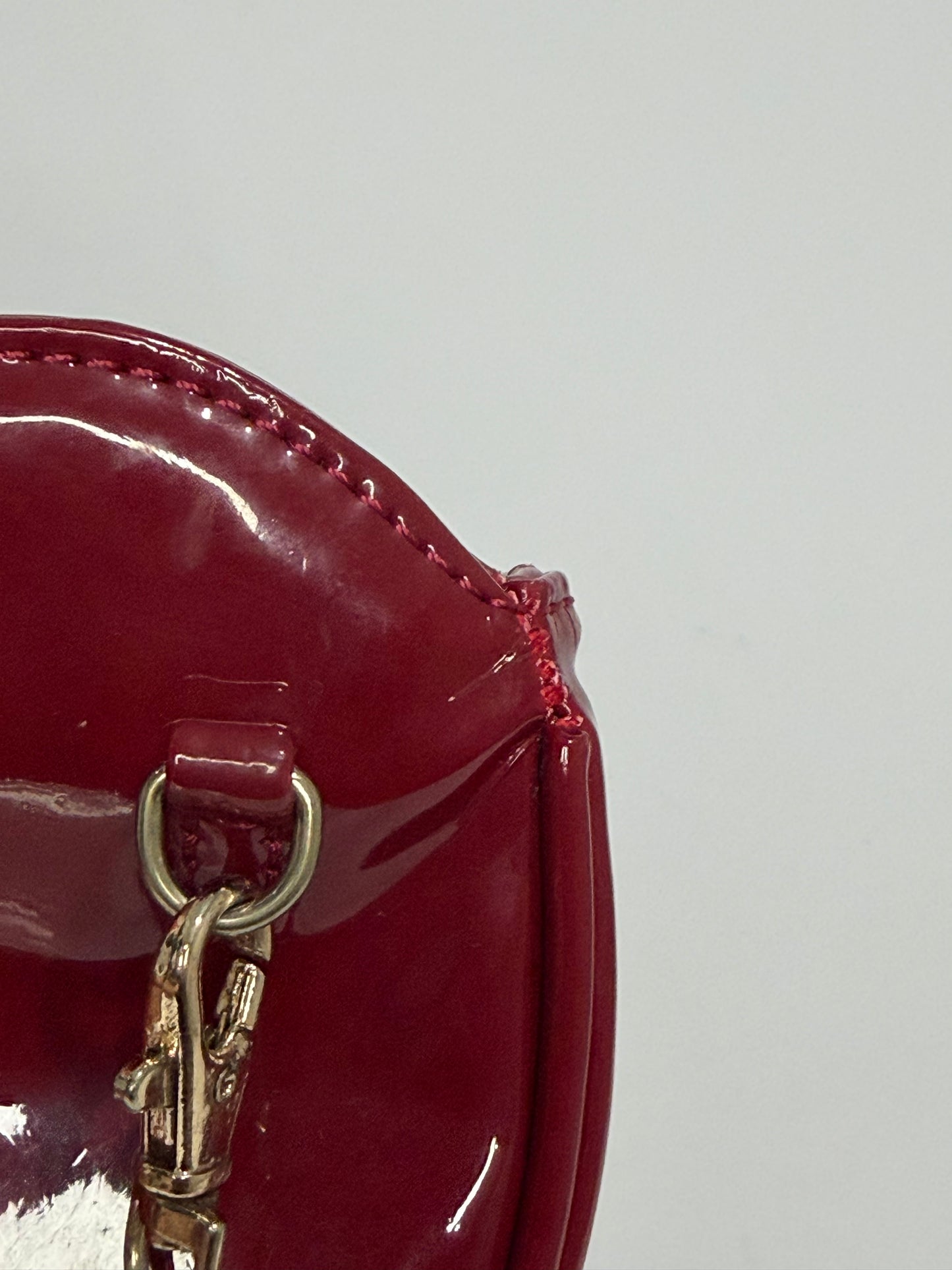 Vivienne Westwood
Patent Leather Heart Crossbody Bag