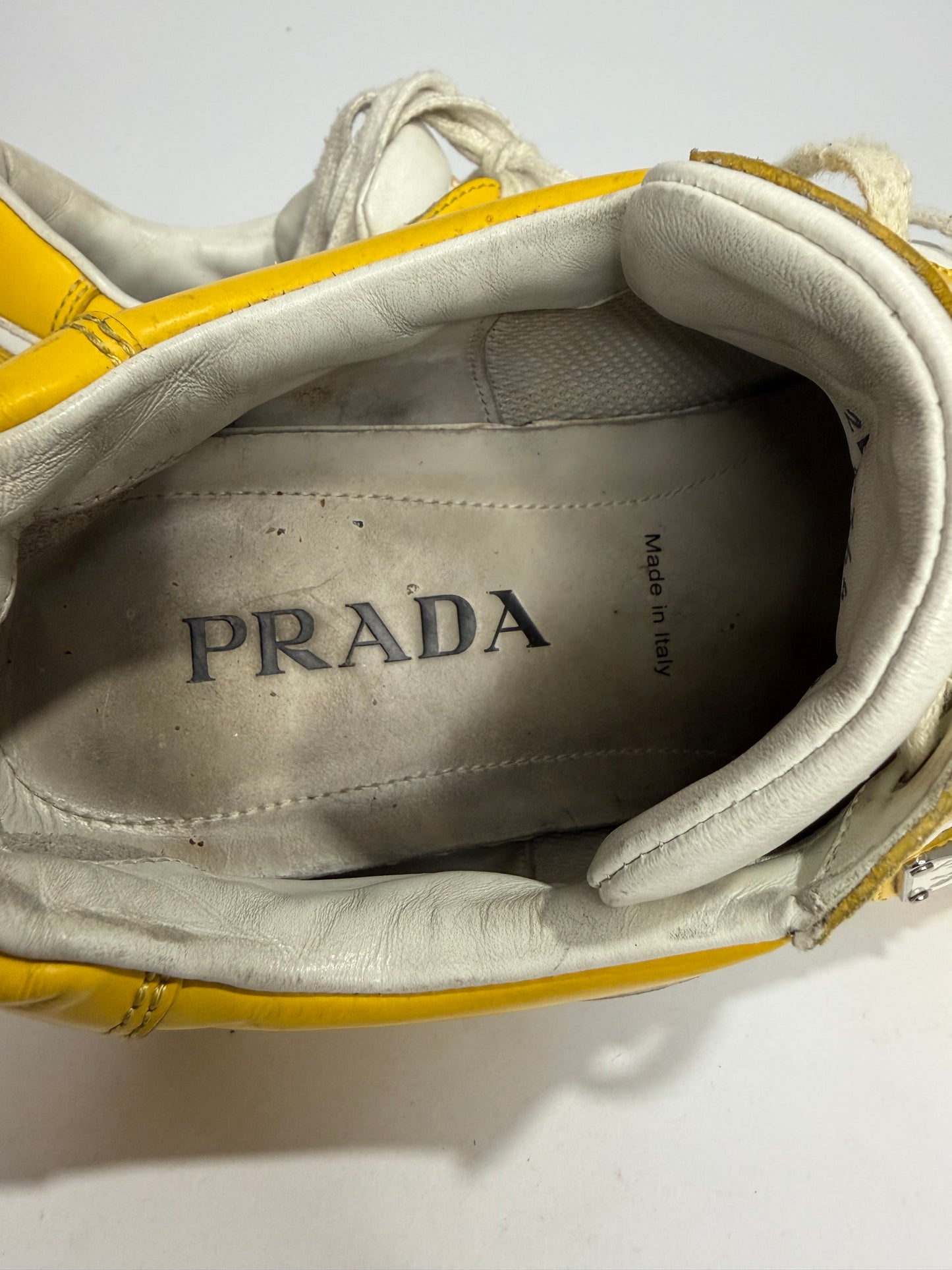 Prada
Enameled Metal Triangle Leather Sneakers