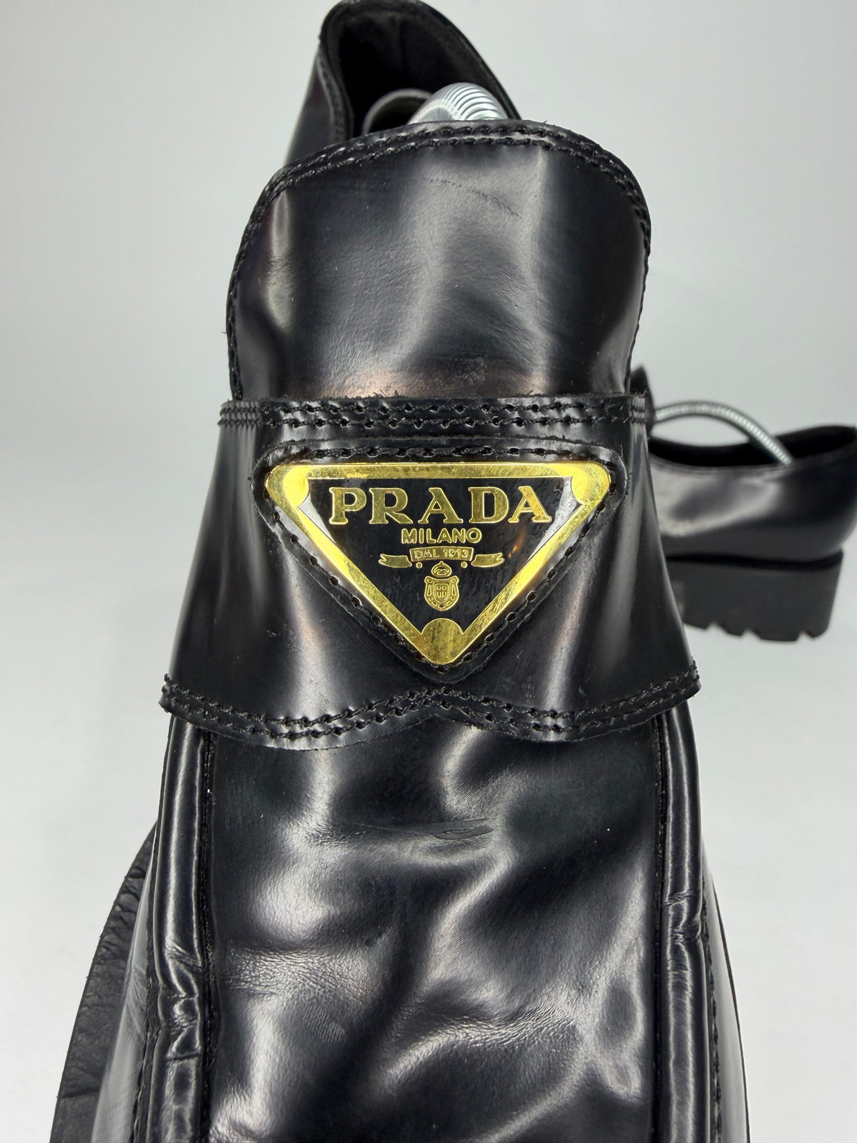 Prada
Enameled Metal Triangle Leather Loafers
Women's Size 38 EU/ 8 US
