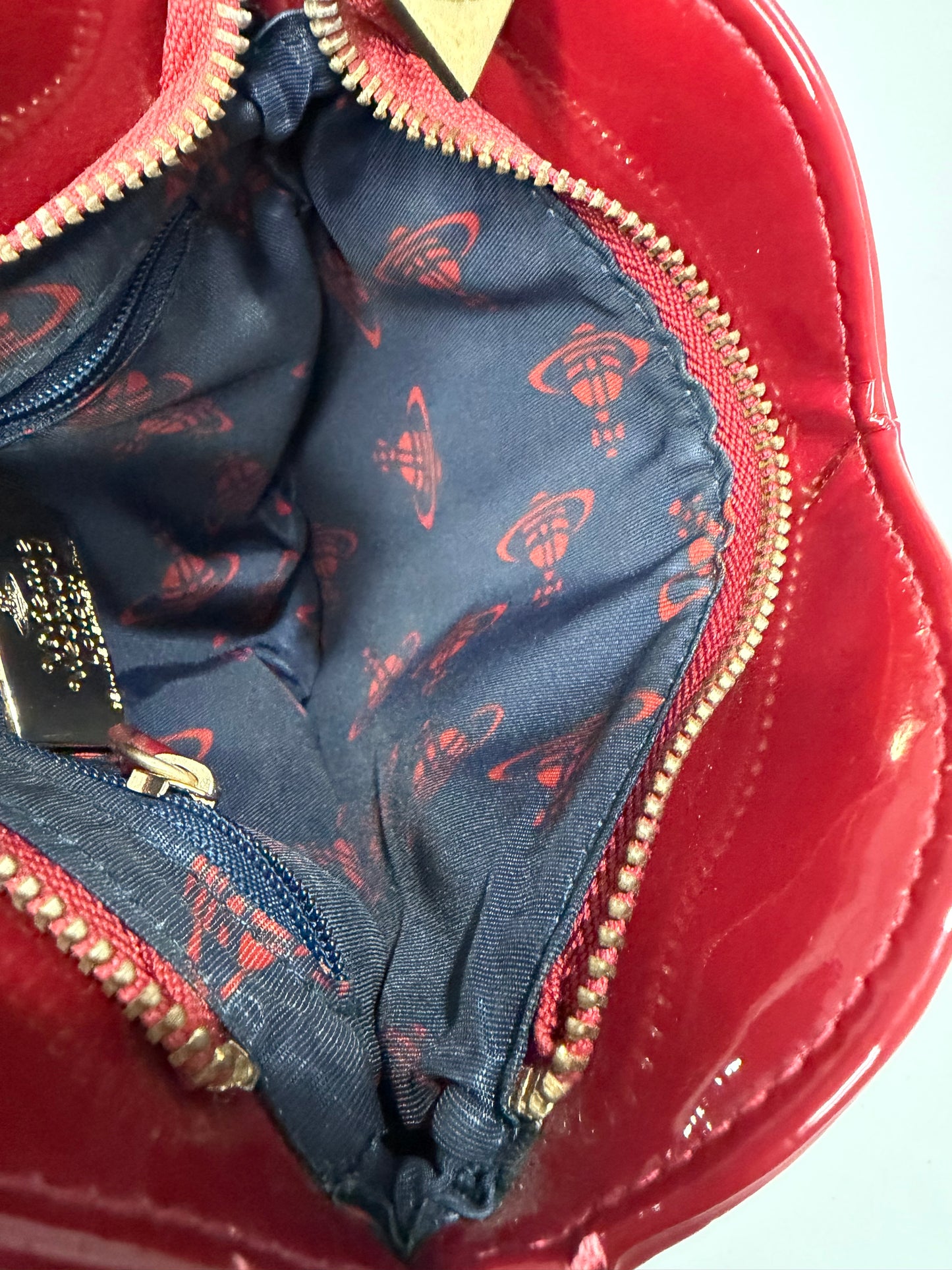 Vivienne Westwood
Patent Leather Heart Crossbody Bag