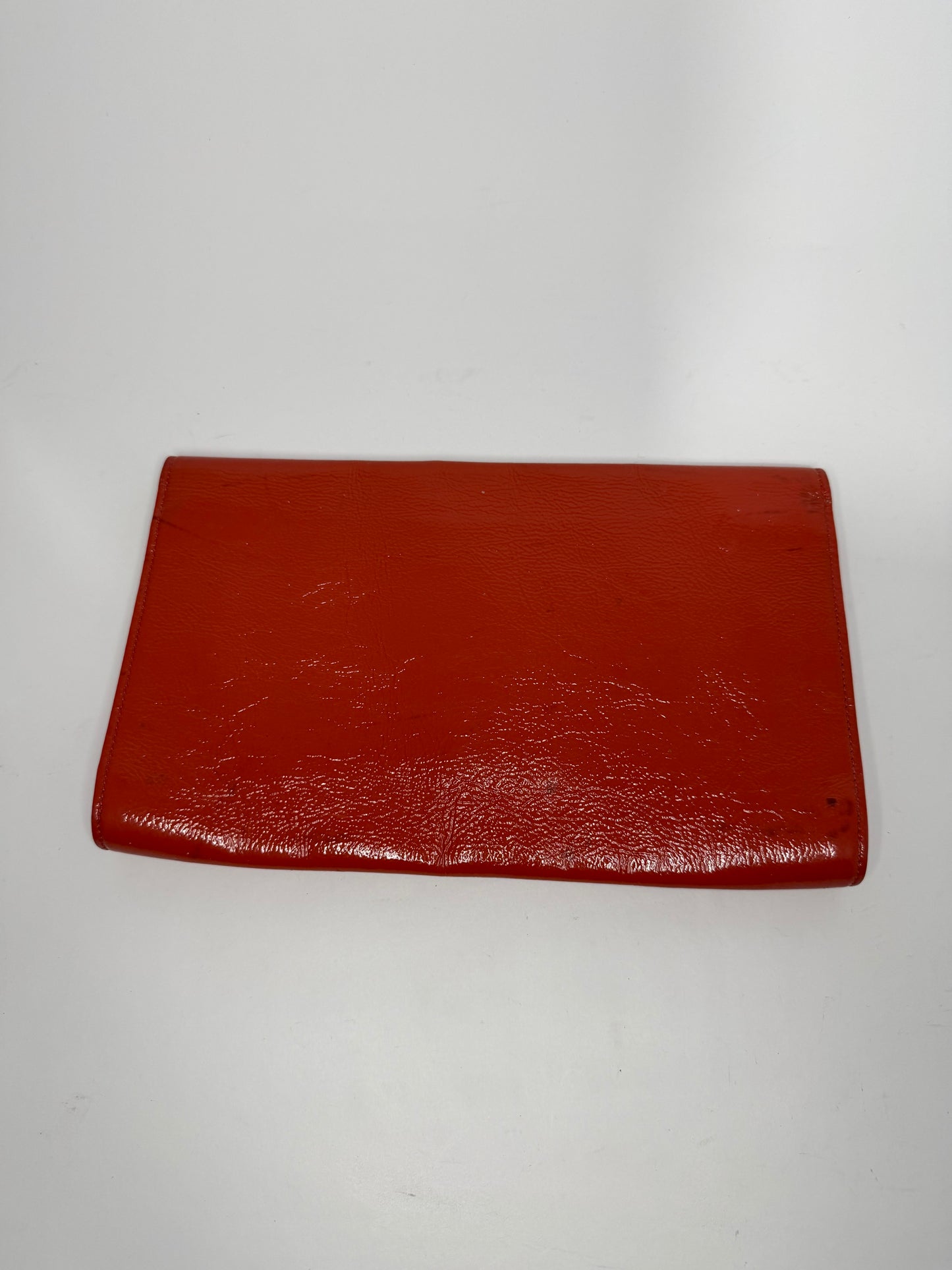 YVES SAINT LAURENT
Dark Orange Patent Leather Belle De Jour Large Clutch Bag