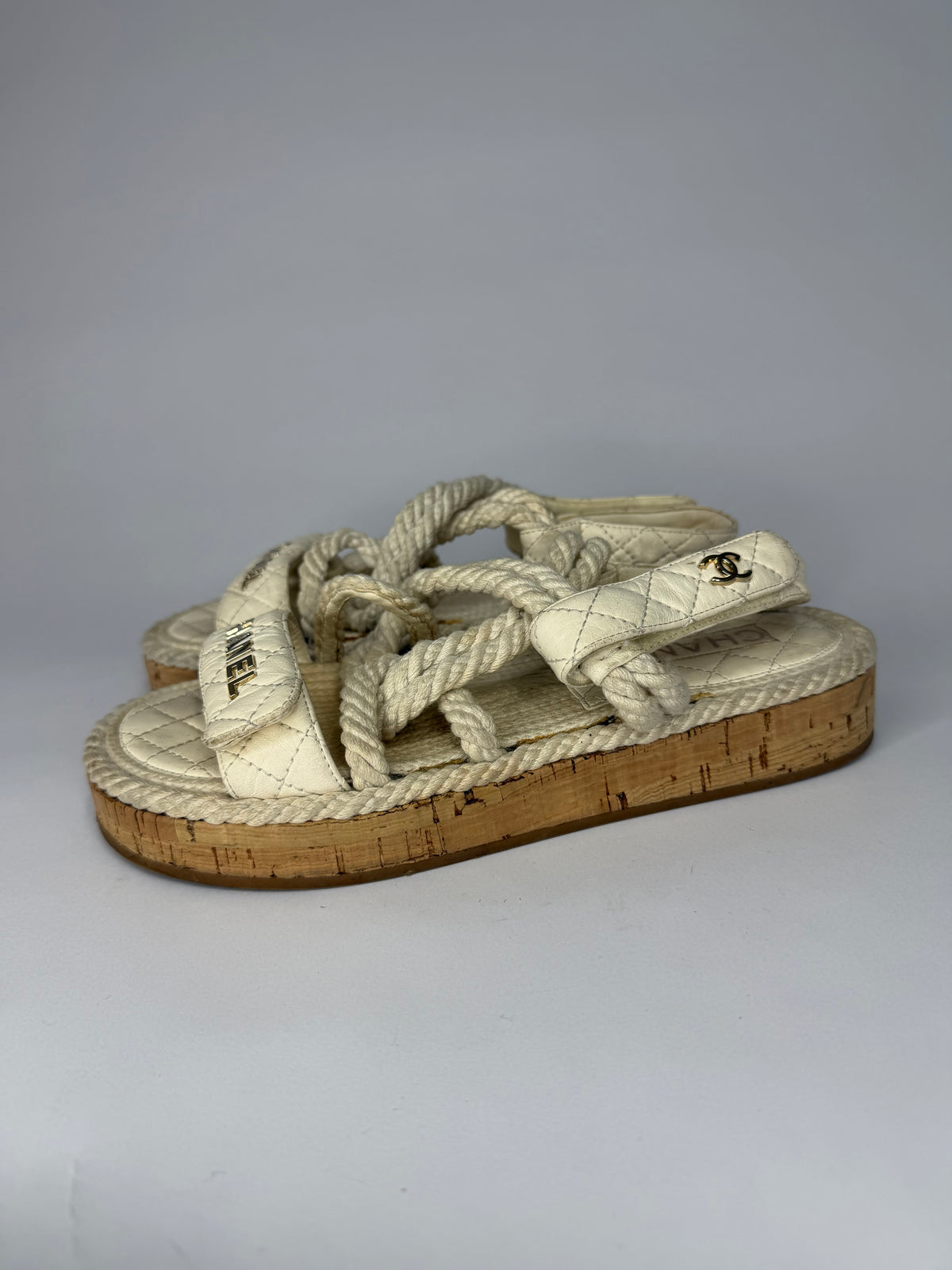 CHANEL
Cord Lambskin Quilted Logo Sandals White Size 37 EU/ 4 UK/ 7 US