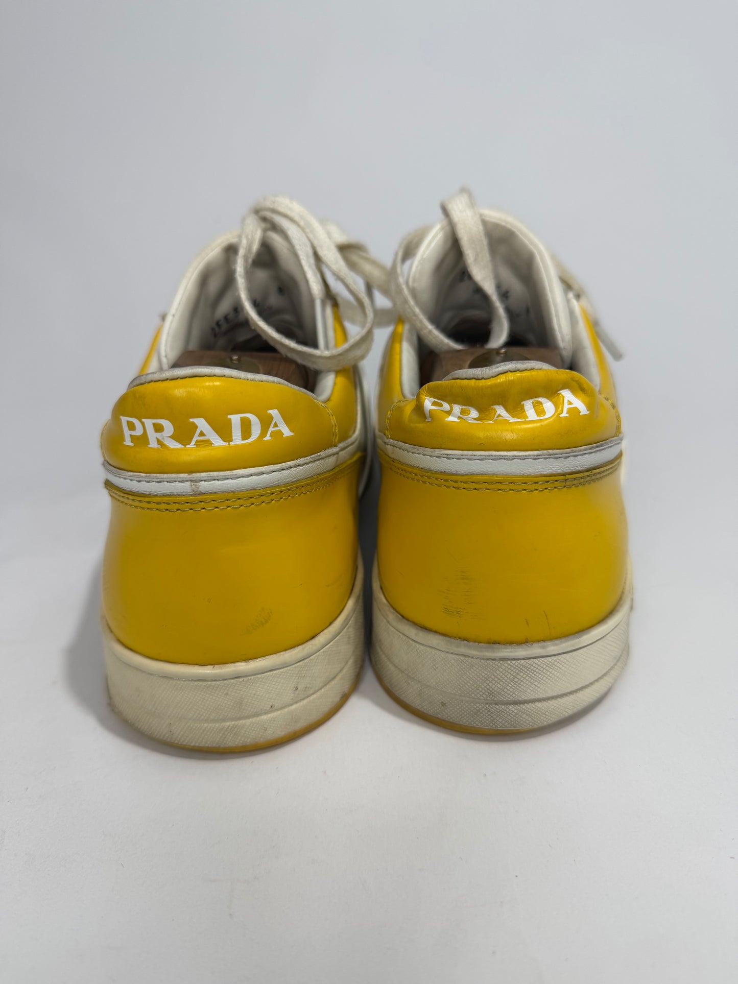 Prada
Enameled Metal Triangle Leather Sneakers