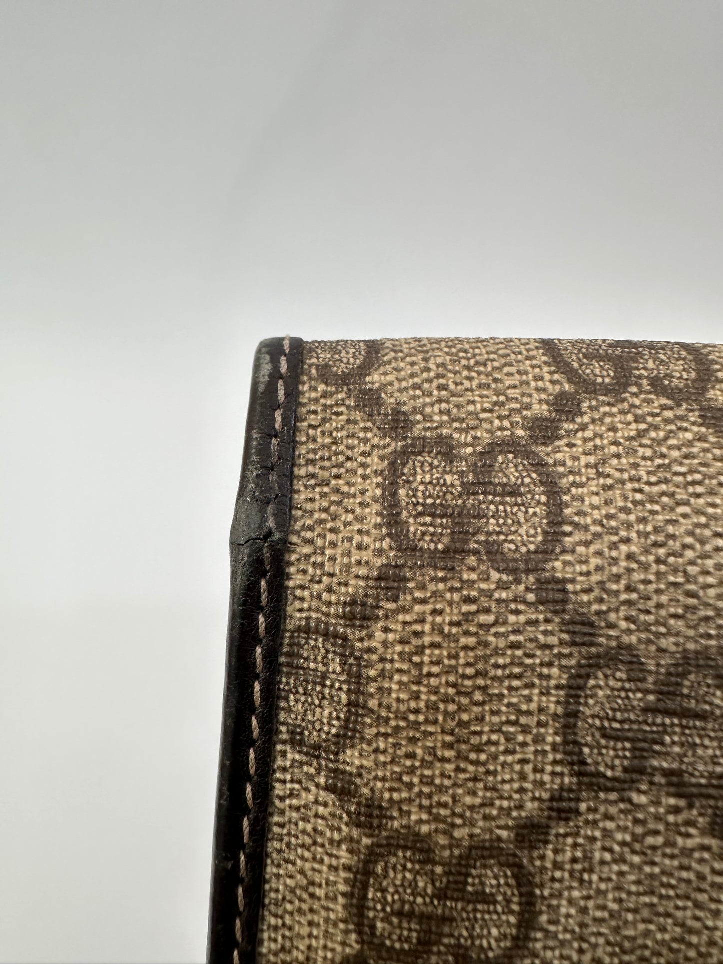 GUCCI 
GG Supreme Monogram Clutch Document Holder Brown