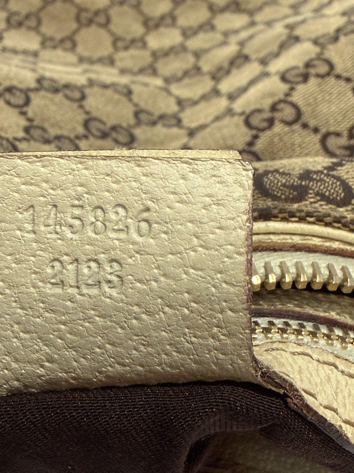 GUCCI
Beige/White GG Canvas Horsebit Creole Hobo Bag