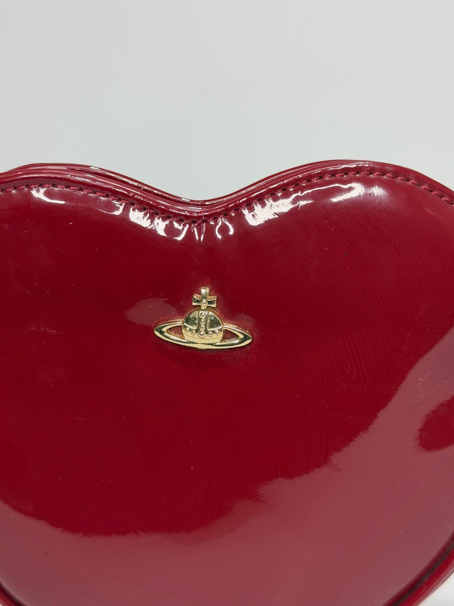 Vivienne Westwood
Patent Leather Heart Crossbody Bag