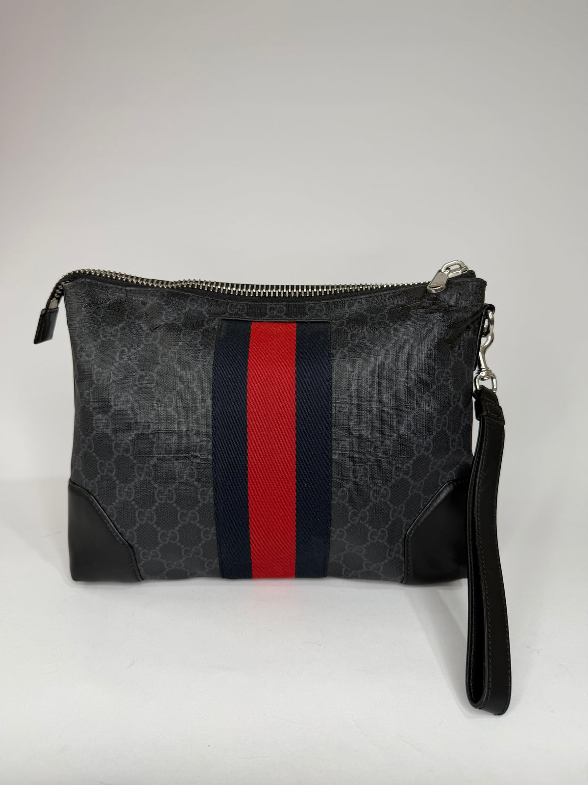 GUCCI
GG Supreme Clutch Bag