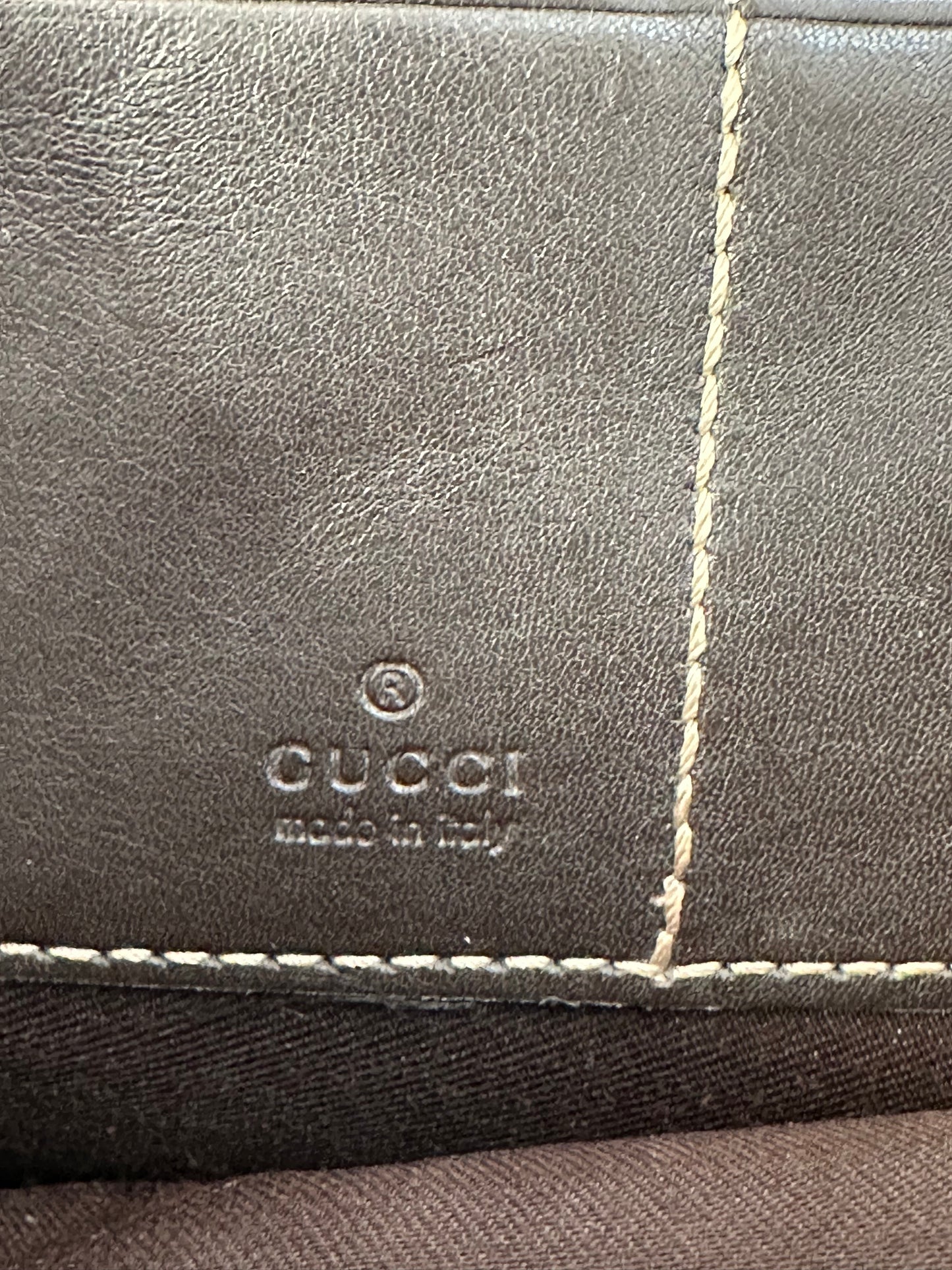 GUCCI 
GG Supreme Monogram Clutch Document Holder Brown