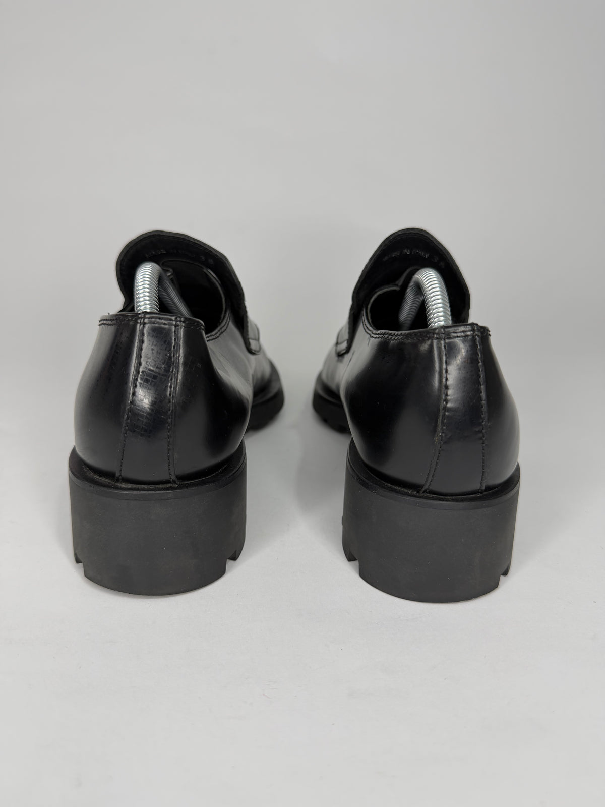 Prada
Enameled Metal Triangle Leather Loafers
Women's Size 38 EU/ 8 US