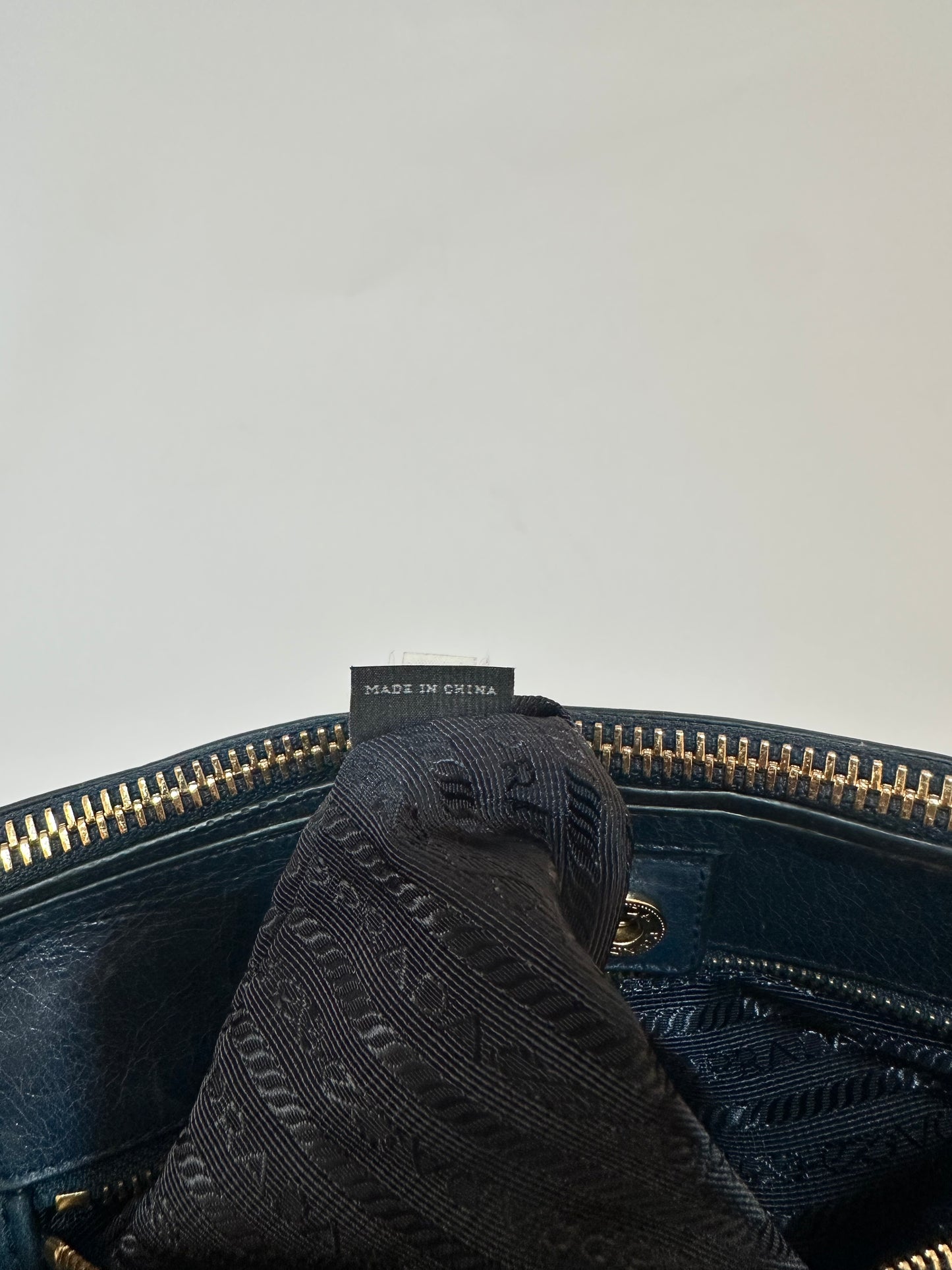 PRADA
Denim Blue Vitello Shine Leather Bauletto Bag