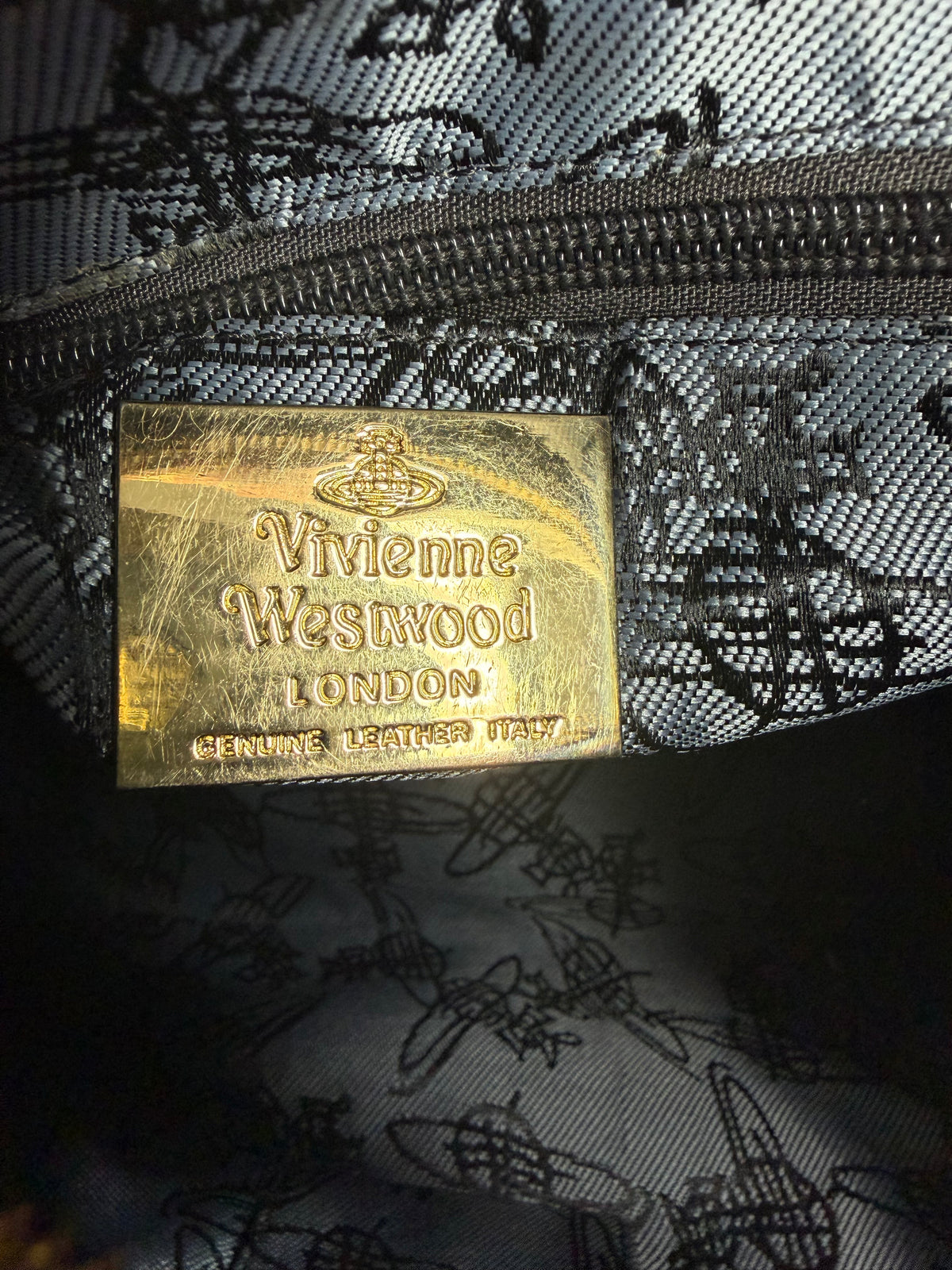 Vivienne Westwood
Leather Trim Coated Canvas Handle Bag