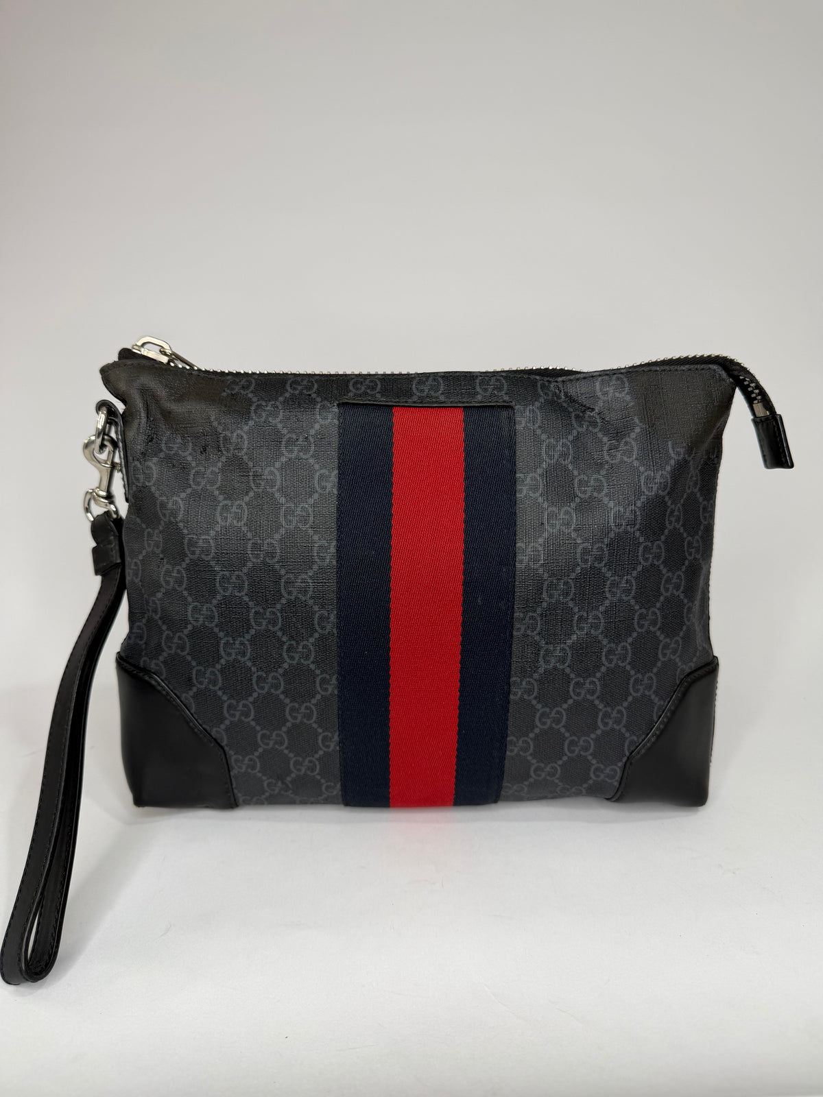 GUCCI
GG Supreme Clutch Bag