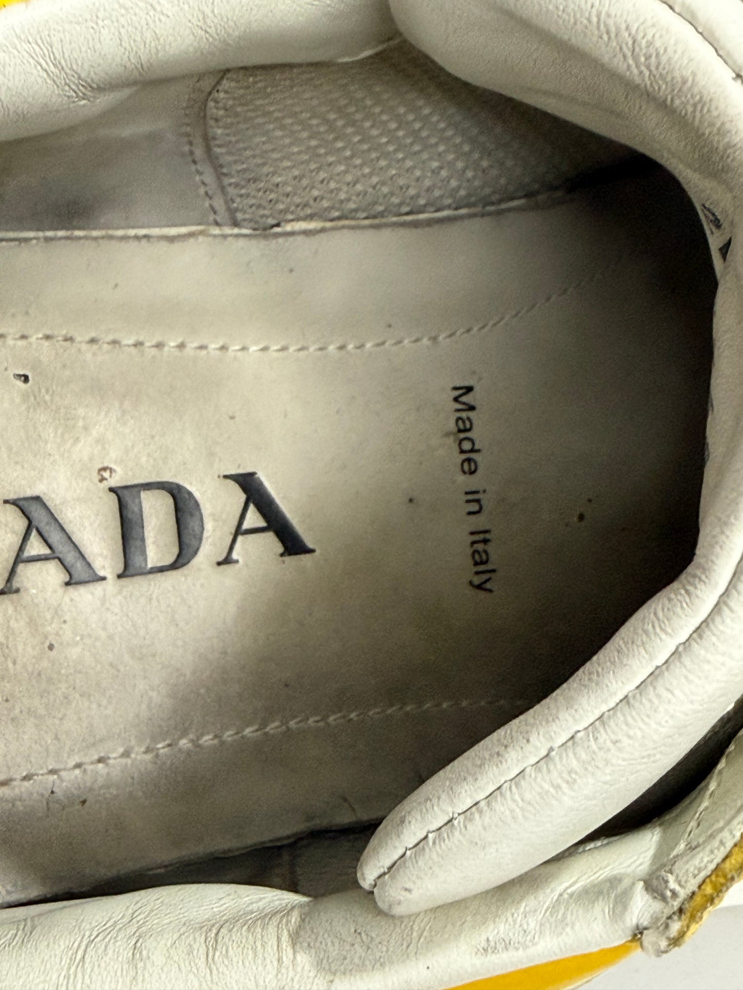 Prada
Enameled Metal Triangle Leather Sneakers