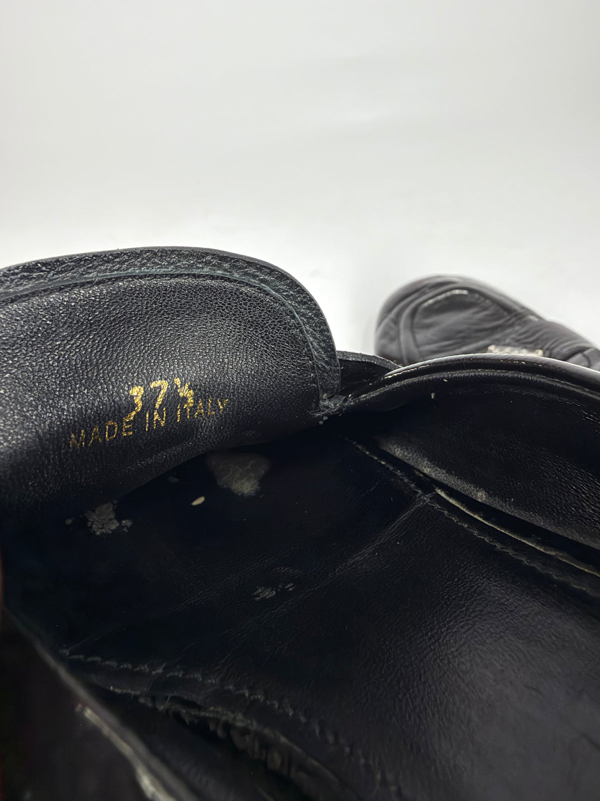 Prada
Enameled Metal Triangle Leather Loafers
Women's Size 37.5 EU/ 7.5 US/ 4.5 UK